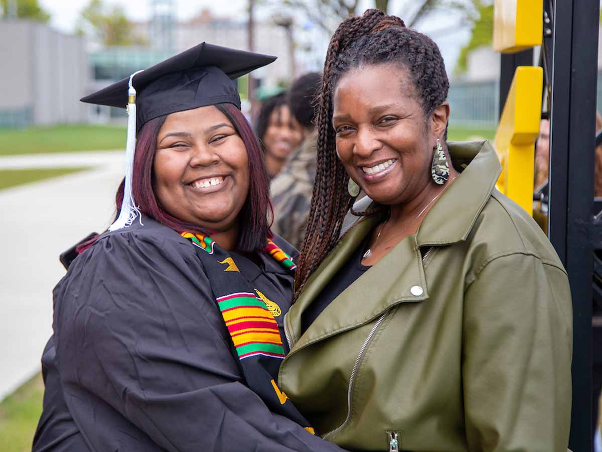 Graduate smiling with her mother