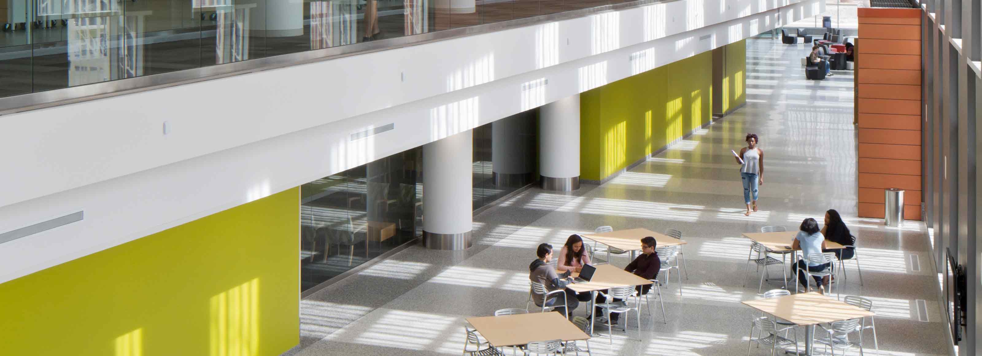 Interior of the iBio building with students working